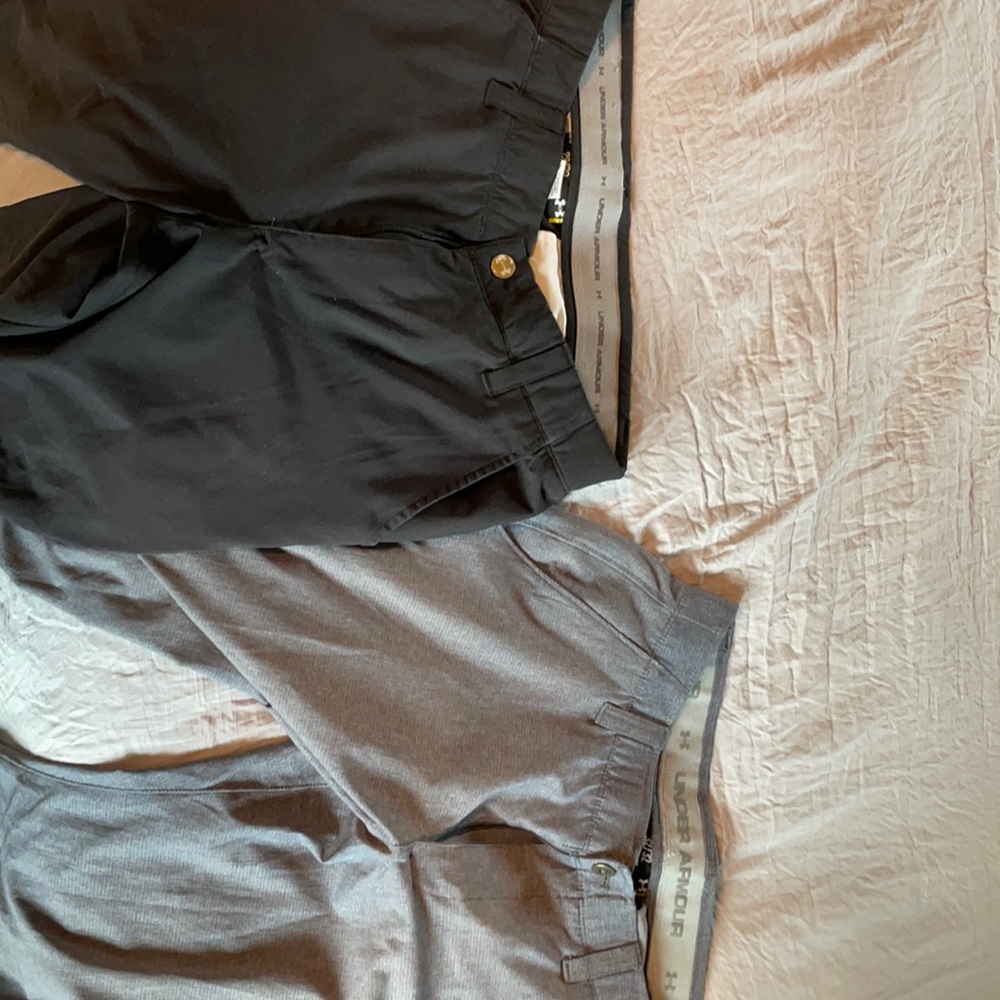 Two pairs of under armour golf pants.